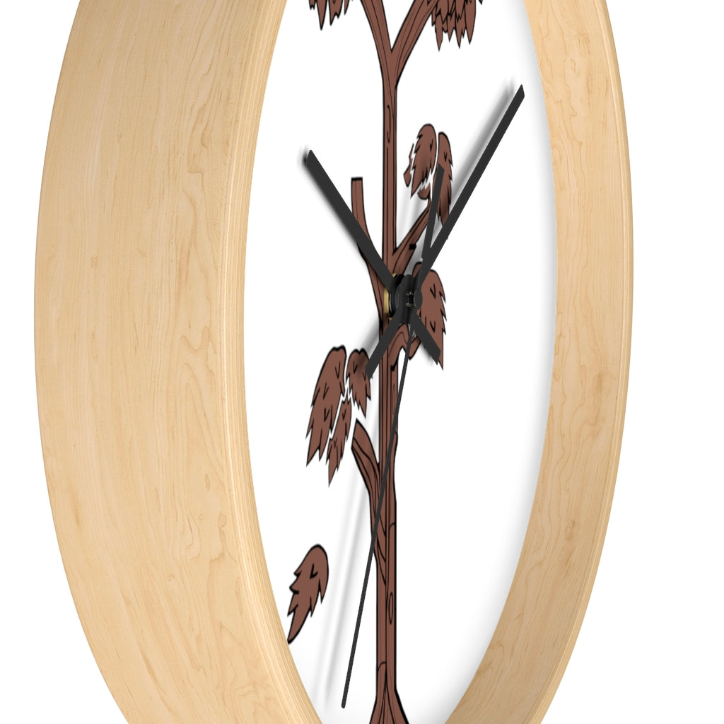 A beautifully designed Tree Wall Clock featuring a wooden frame and a clear plexiglass face, showcasing a unique tree-inspired design.