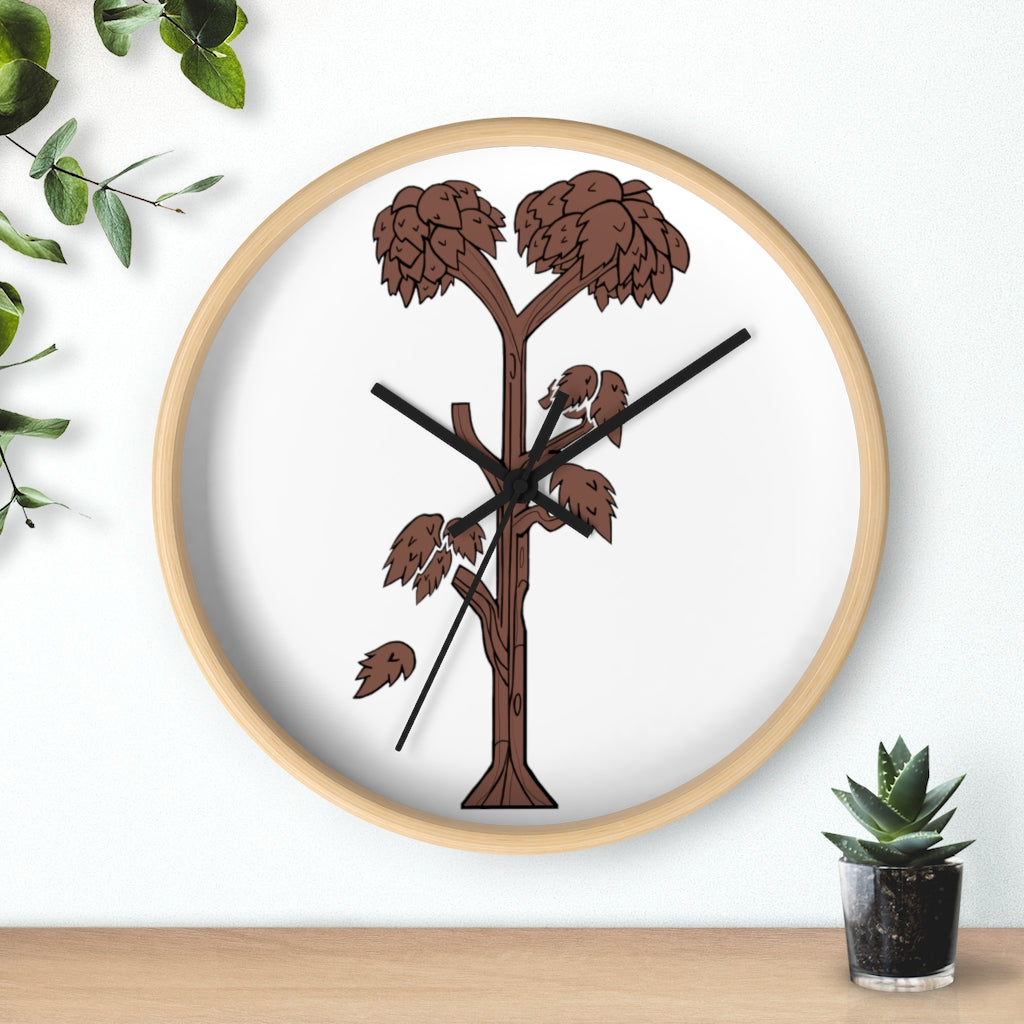 A beautifully designed Tree Wall Clock featuring a wooden frame and a clear plexiglass face, showcasing a unique tree-inspired design.