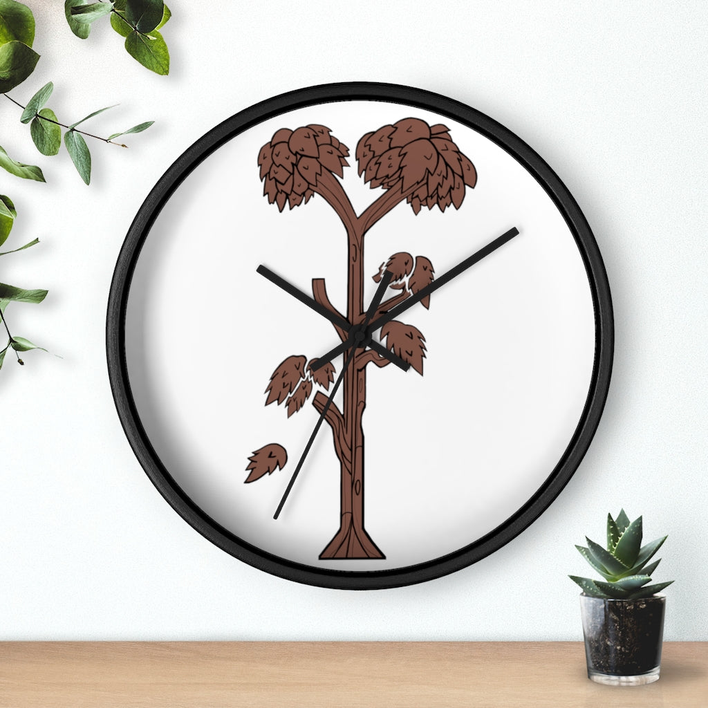 A beautifully designed Tree Wall Clock featuring a wooden frame and a clear plexiglass face, showcasing a unique tree-inspired design.