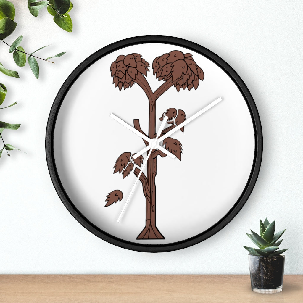 A beautifully designed Tree Wall Clock featuring a wooden frame and a clear plexiglass face, showcasing a unique tree-inspired design.