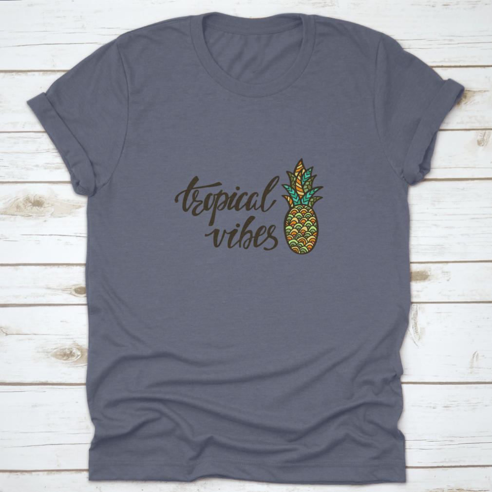 A stylish Tropical Vibes T-shirt featuring modern calligraphy with an inspirational summer quote, made from soft cotton fabric.