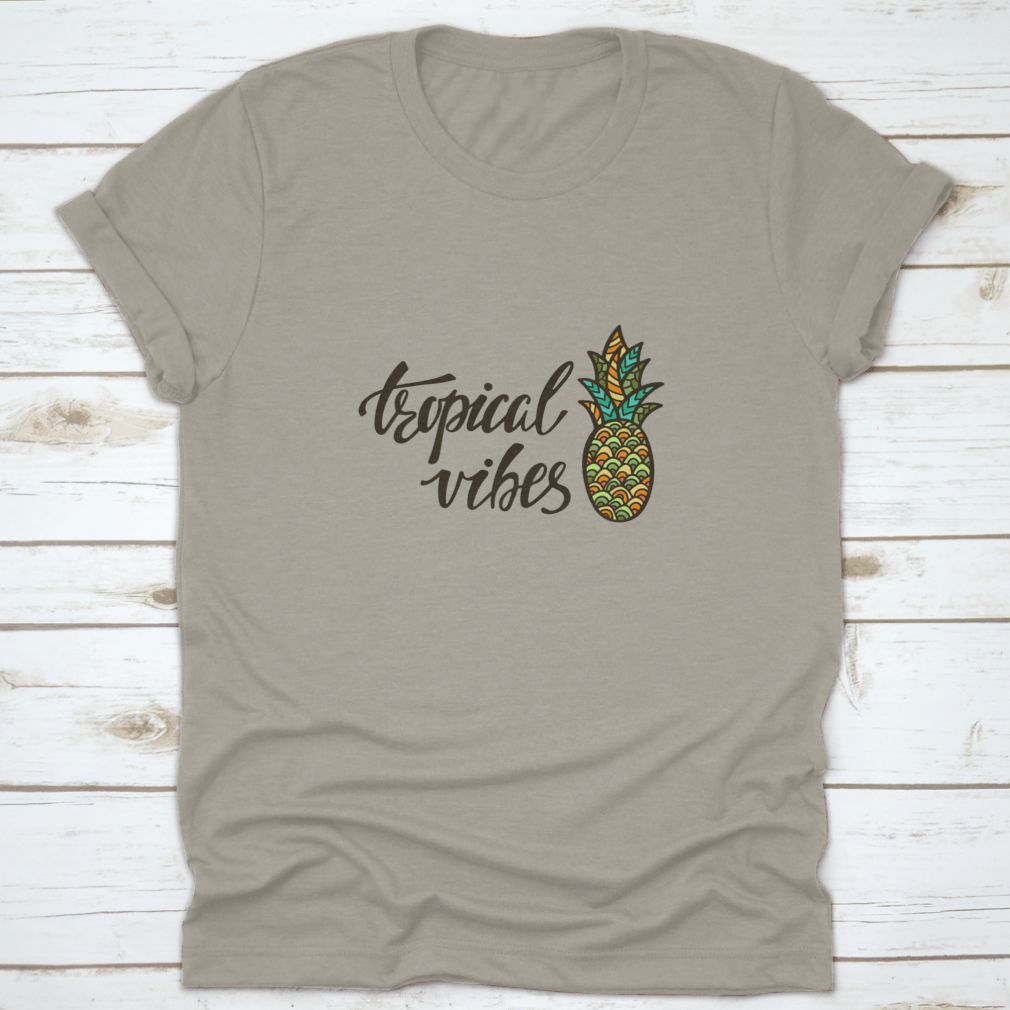 A stylish Tropical Vibes T-shirt featuring modern calligraphy with an inspirational summer quote, made from soft cotton fabric.