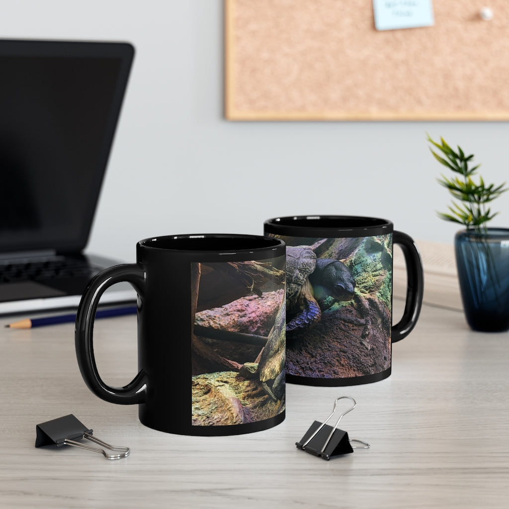 Turtle 11oz black ceramic mug with a sleek design, perfect for coffee, tea, or hot chocolate.