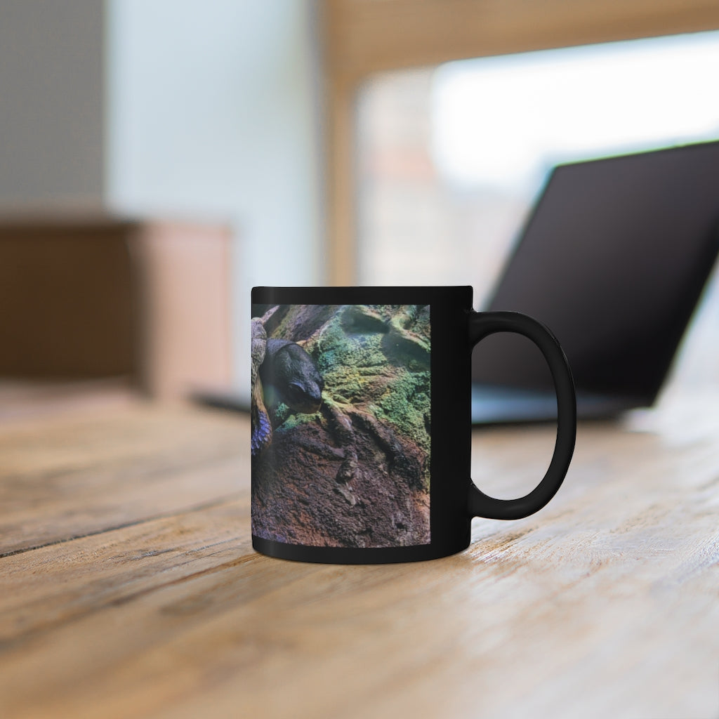 Turtle 11oz black ceramic mug with a sleek design, perfect for coffee, tea, or hot chocolate.