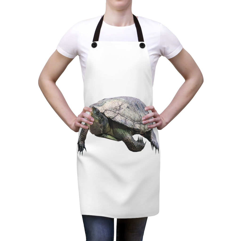 A stylish Turtle Apron made of lightweight polyester with a custom design and black detachable twill straps, perfect for cooking.