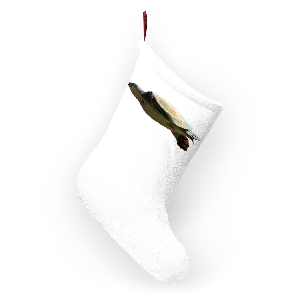 A cozy Turtle Christmas Stocking made of soft polyester fleece, featuring a festive design and a twill ribbon hanging loop, perfect for holiday decor.