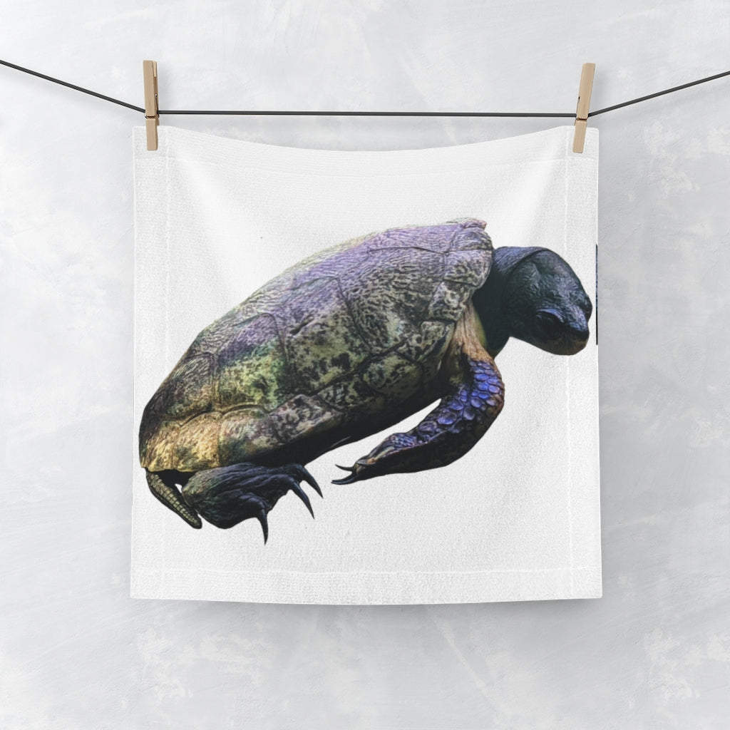 A Turtle Face Towel featuring a vibrant polyester front for printing and a soft, absorbent cotton back, ideal for personalizing your bathroom.