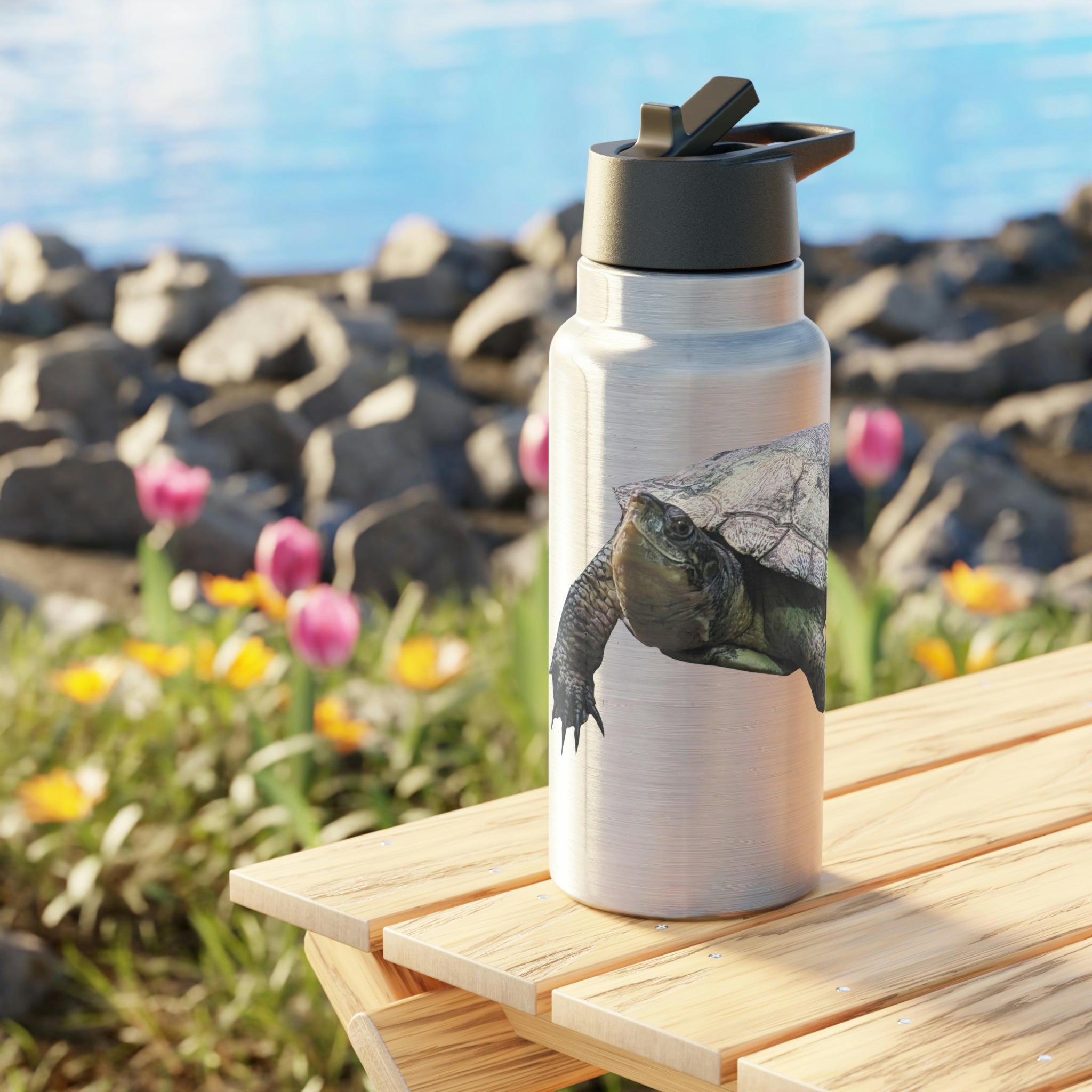 Turtle Gator Tumbler in stainless steel with a black screw-on cap and a plastic straw, showcasing a customizable design.