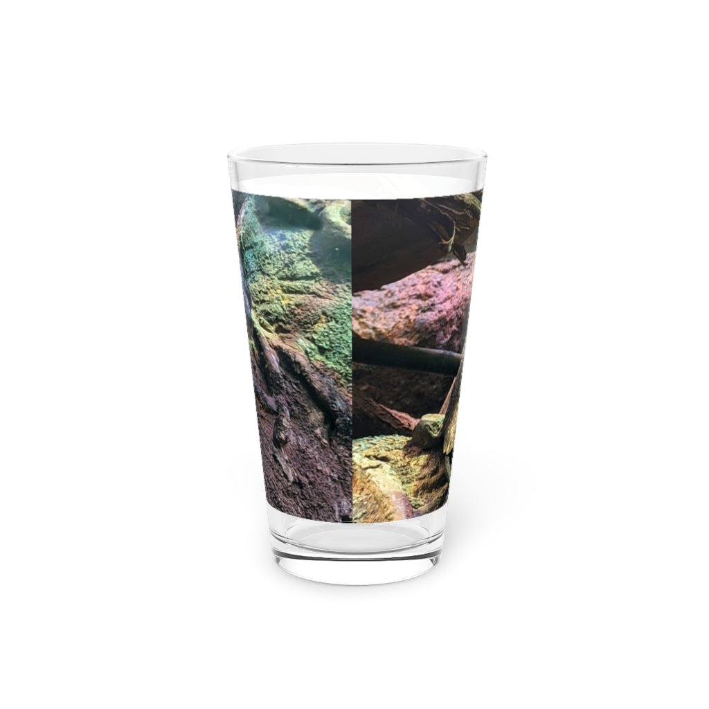 A clear 16oz Turtle Pint Glass showcasing a custom printed design, perfect for beverages.