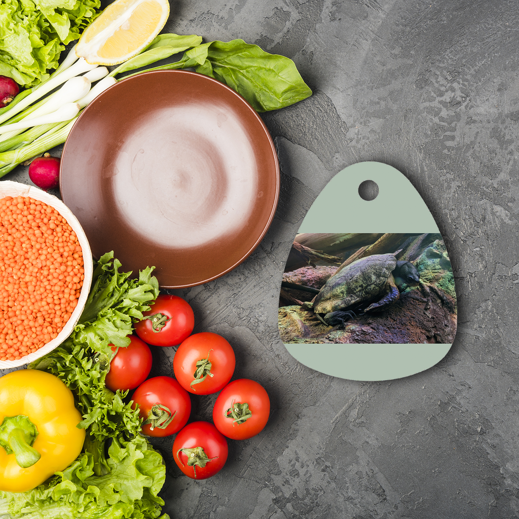 Round Turtles Sublimation Glass Cutting Board with a smooth surface, featuring a customizable design area and four rubber feet for stability.