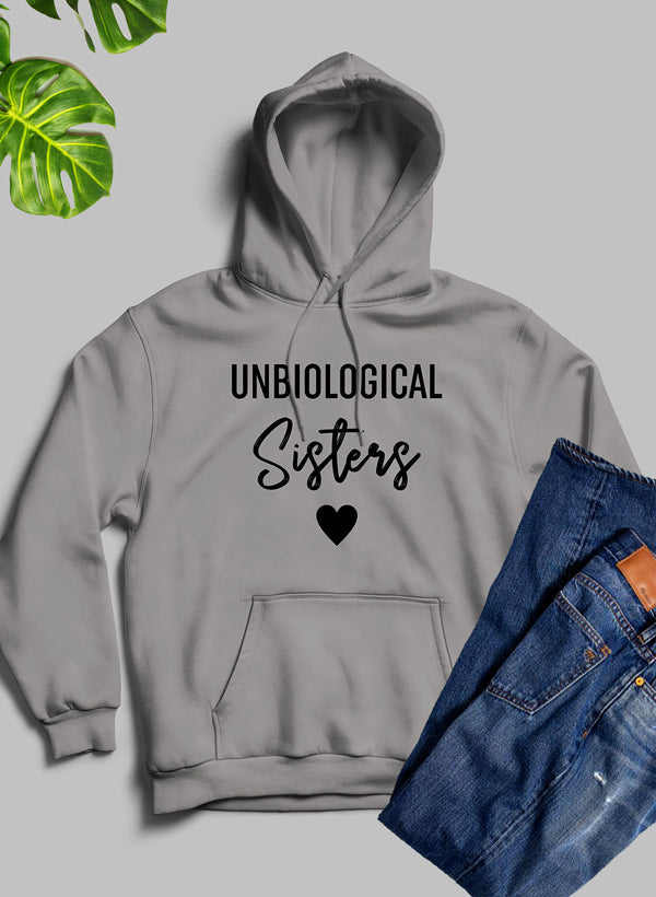 Unbiological Sisters Hoodie featuring unique artistic designs, cozy fleece material, and adjustable hood.