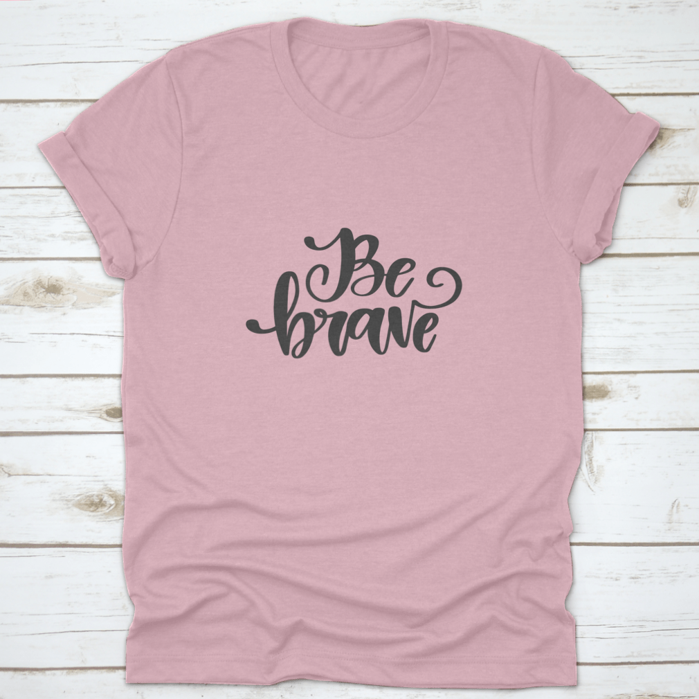 Vector hand drawn t-shirt featuring the motivational quote 'Be Brave' on a soft cotton fabric, showcasing a classic fit and stylish design.