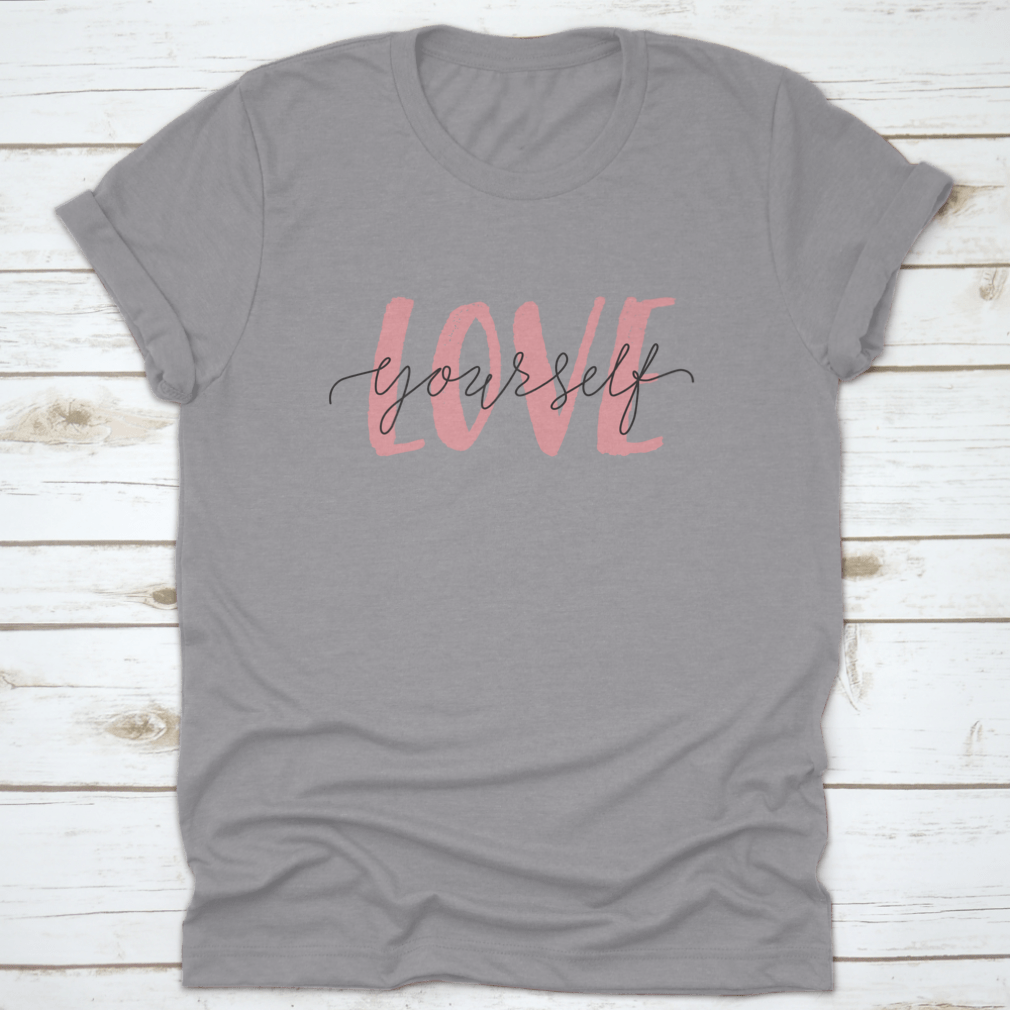 Vector illustration of a T-shirt featuring the 'Love Yourself' lettering quote, promoting self-care and positivity.