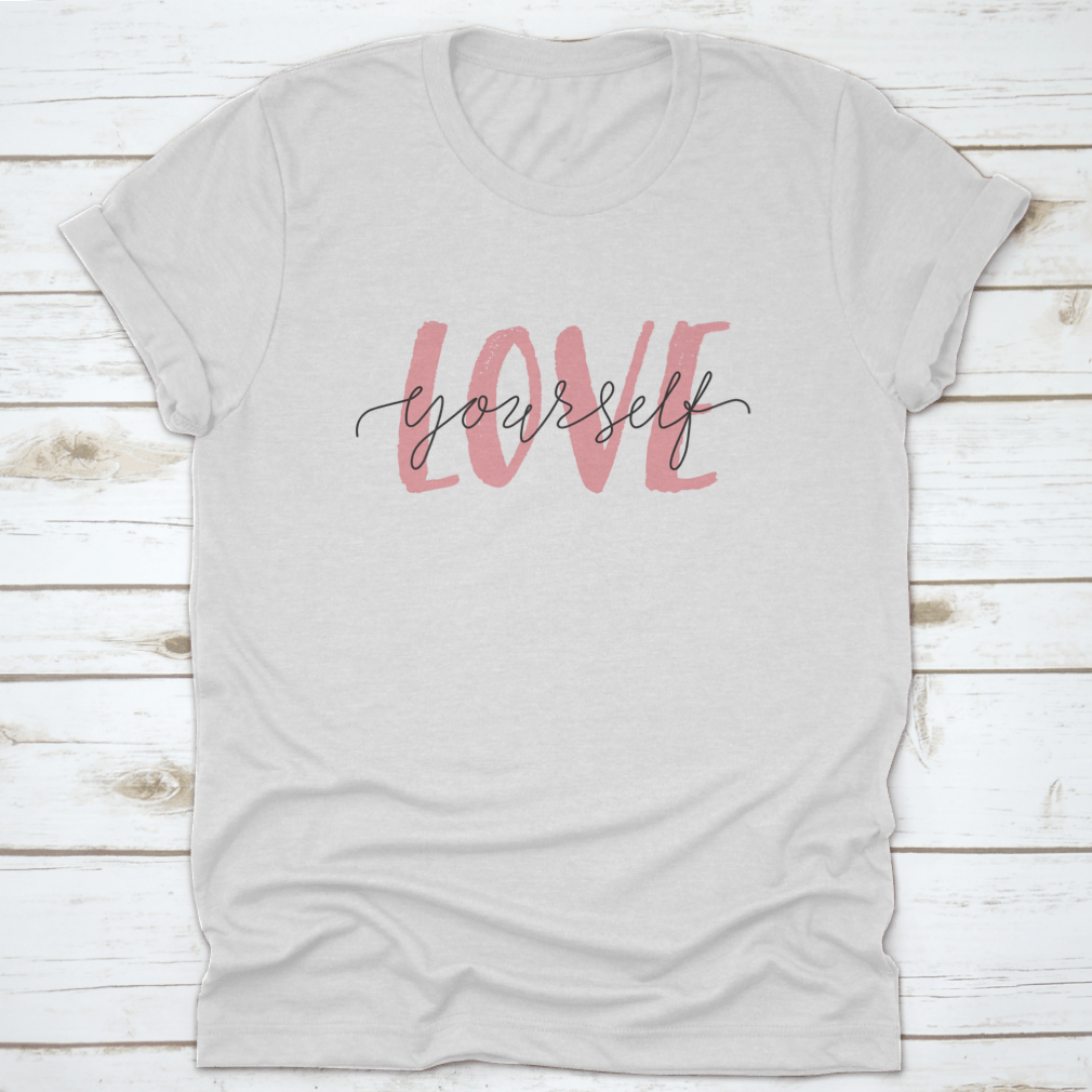 Vector illustration of a T-shirt featuring the 'Love Yourself' lettering quote, promoting self-care and positivity.