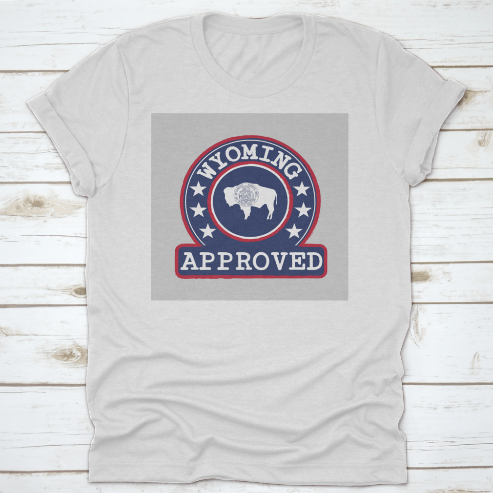 Vector stamp of approved logo featuring the Wyoming flag in a round shape, displayed on a comfortable cotton t-shirt.