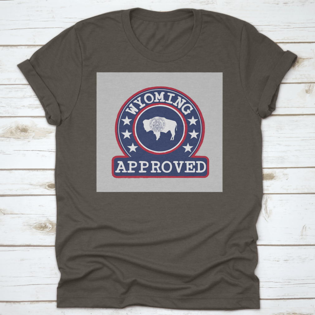 Vector stamp of approved logo featuring the Wyoming flag in a round shape, displayed on a comfortable cotton t-shirt.