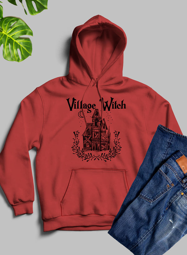 A stylish Village Witch Hoodie featuring unique artistic designs, made from warm fleece blend material with an adjustable hood.