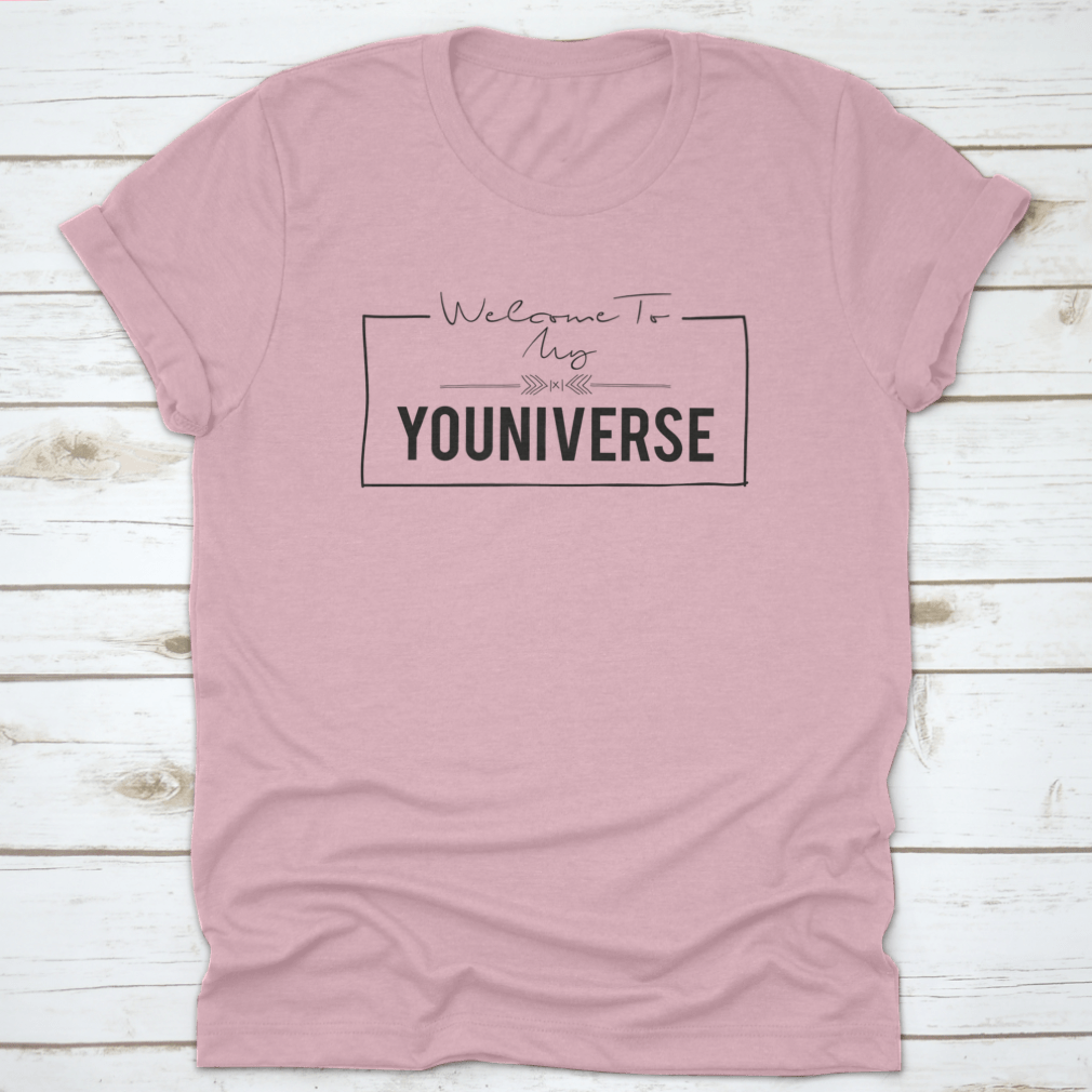 A stylish t-shirt featuring the slogan 'Welcome To My Youniverse' printed on it, made from 100% cotton for comfort.