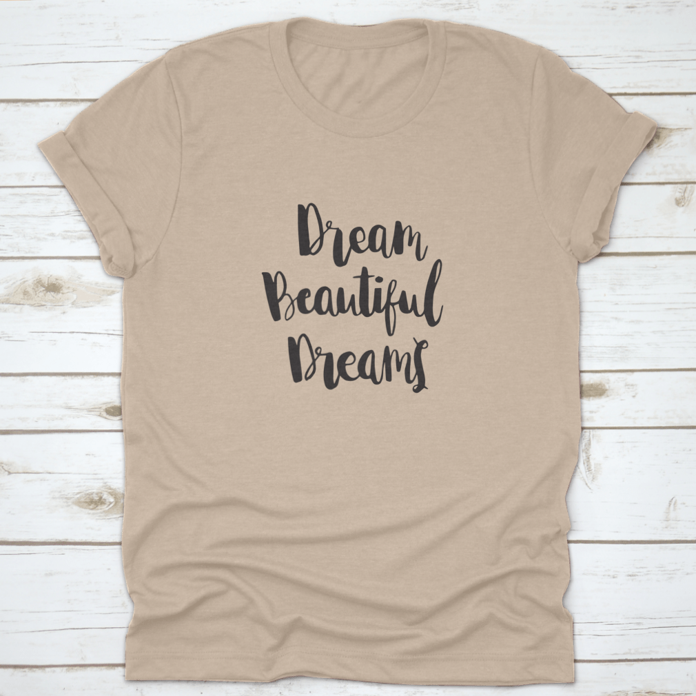 Woman Quote t-shirt with hand lettered 'Dream Beautiful Dreams' on a white background, showcasing soft cotton fabric and classic fit.