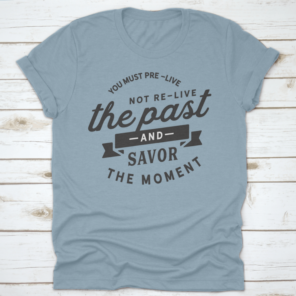 A motivational t-shirt featuring the phrase 'You Must Pre-Live The Future Not Re-Live The Past', made from soft cotton fabric.