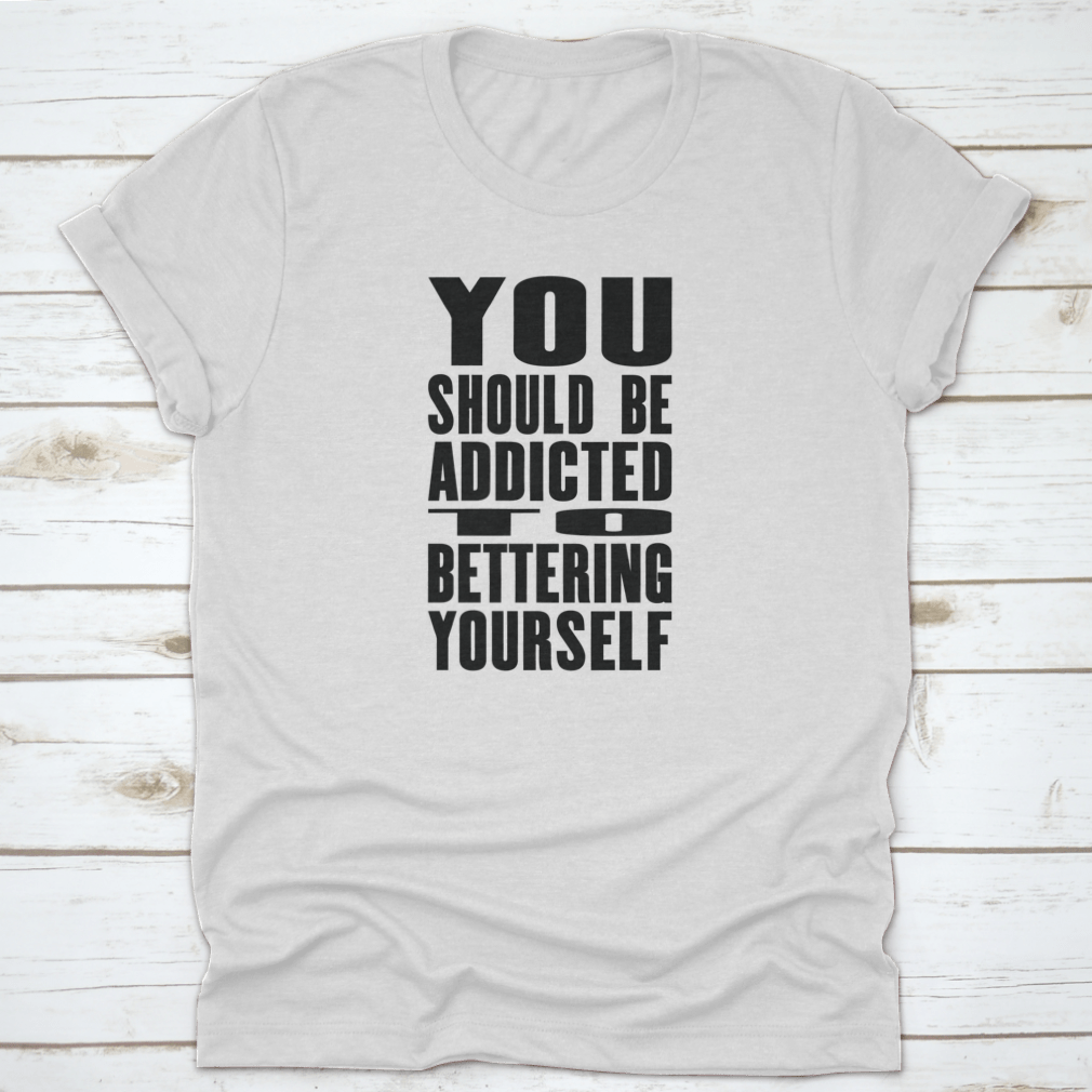 A motivational T-shirt featuring the phrase 'You Should Be Addicted To Bettering Yourself', made from soft cotton fabric.