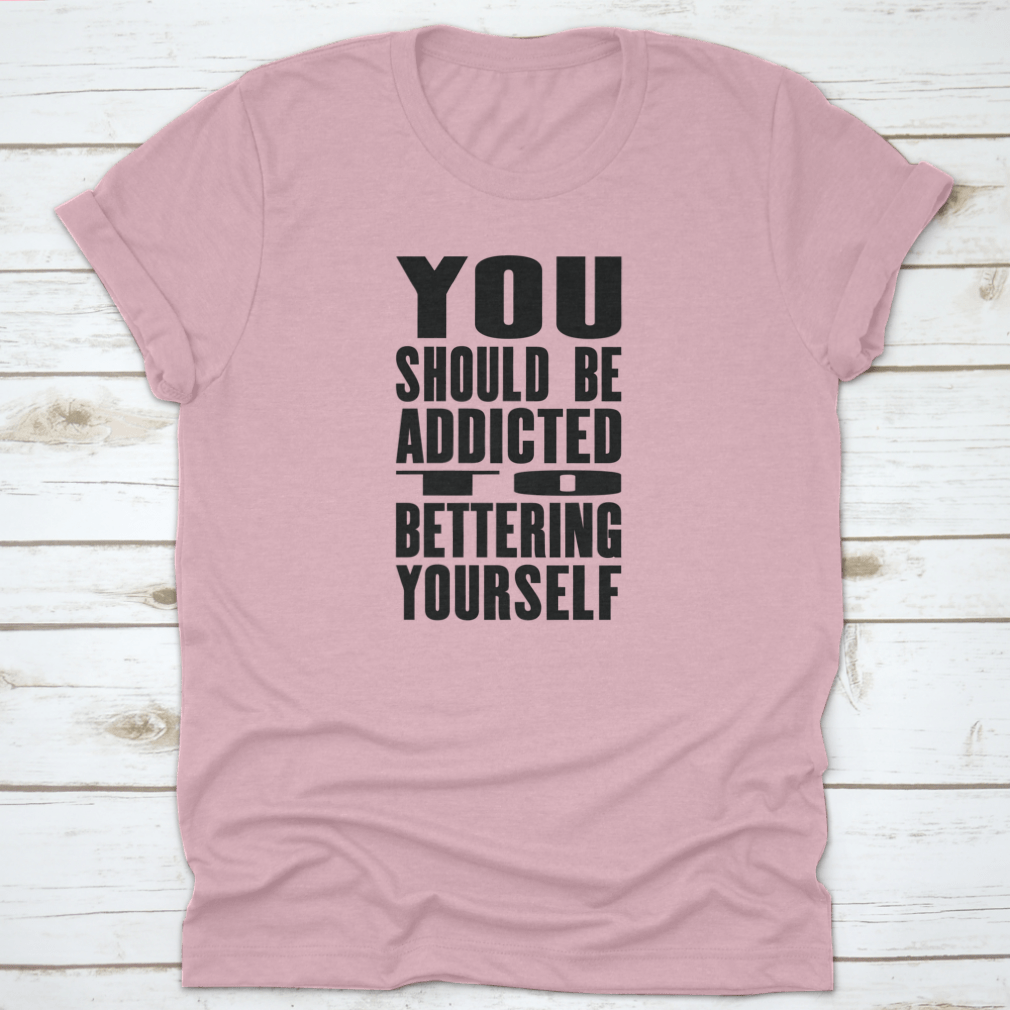 A motivational T-shirt featuring the phrase 'You Should Be Addicted To Bettering Yourself', made from soft cotton fabric.