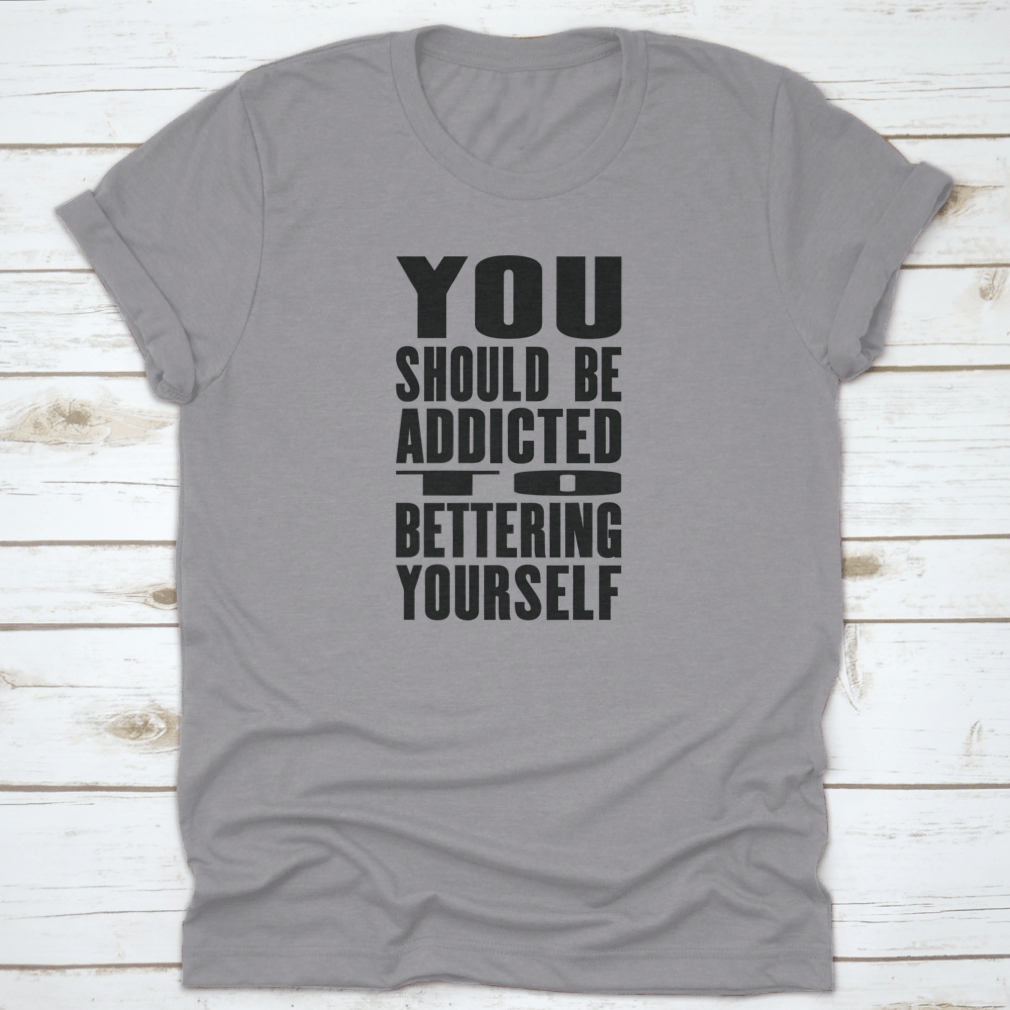 A motivational T-shirt featuring the phrase 'You Should Be Addicted To Bettering Yourself', made from soft cotton fabric.