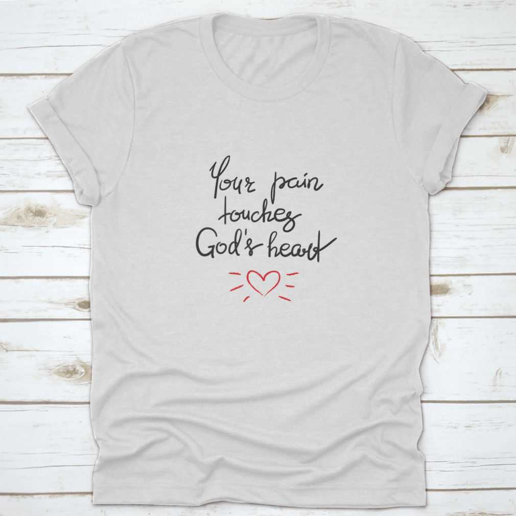 A stylish cotton shirt featuring the motivational quote 'Your Pain Touches God's Heart' in elegant lettering, perfect for religious individuals.