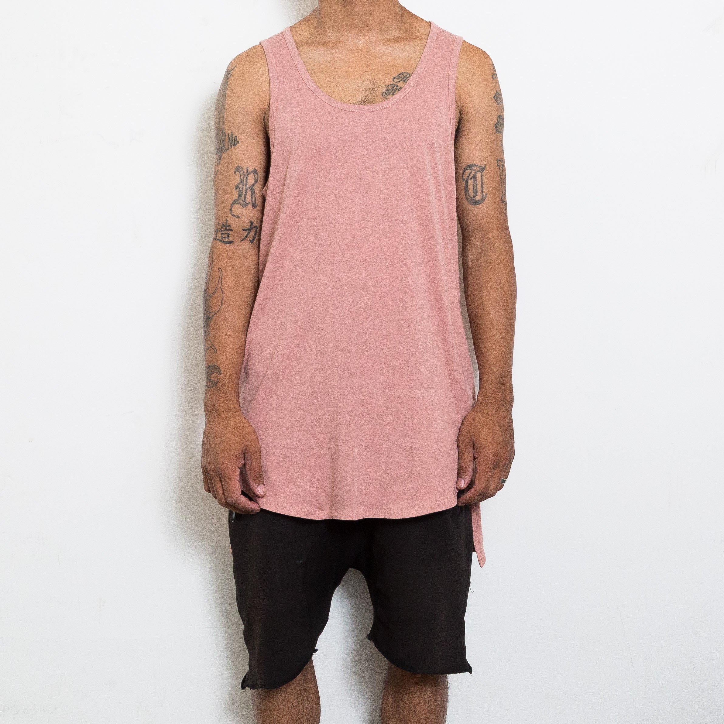 HI LOW TANK in rose color featuring a stylish hi-lo design and muscle tank style, perfect for casual wear.