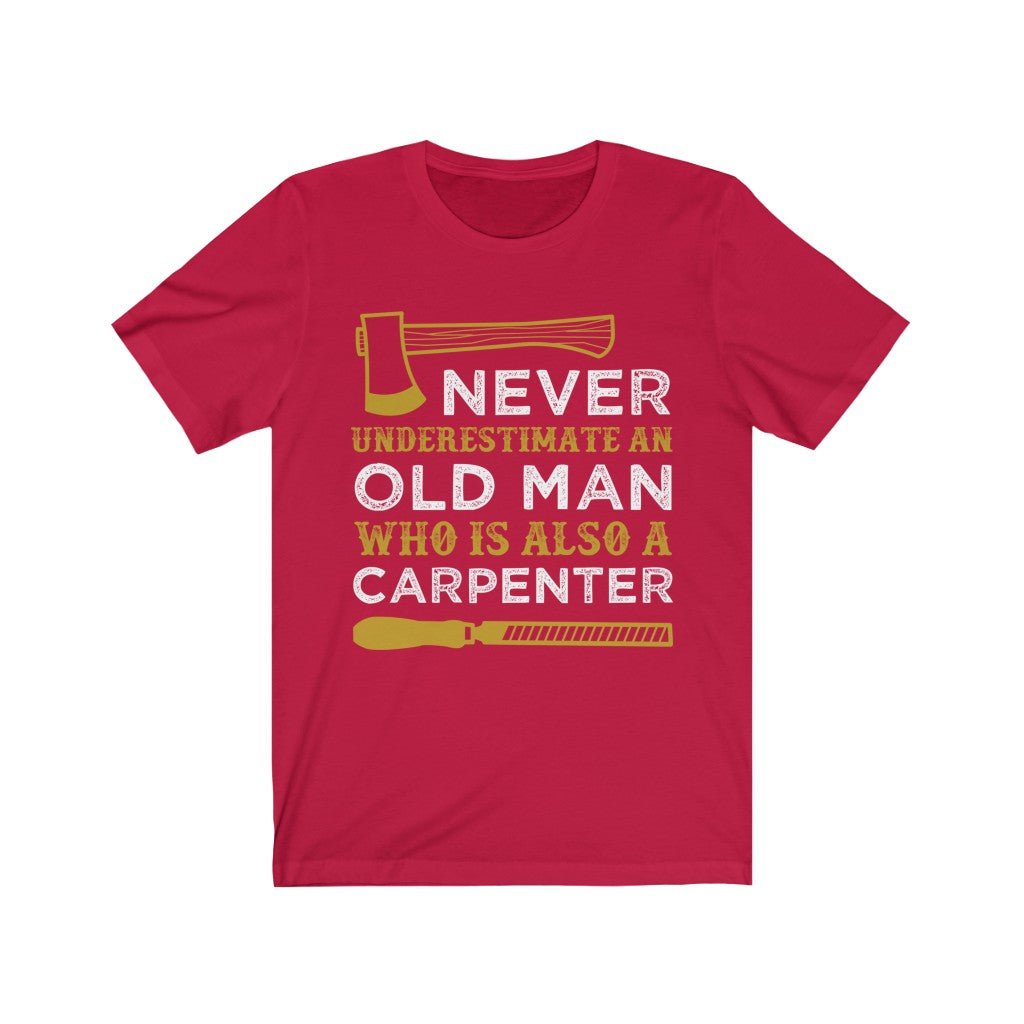 A soft cotton unisex T-shirt featuring the phrase 'Never Understand an Old Man Carpenter' in vibrant vinyl print, designed for comfort and style.