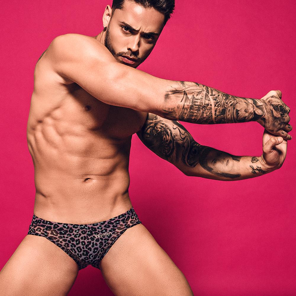 Intymen INI025 Leopard Bikini featuring a bold leopard print design, made from soft polyamide fabric, showcasing its snug fit and contour pouch.