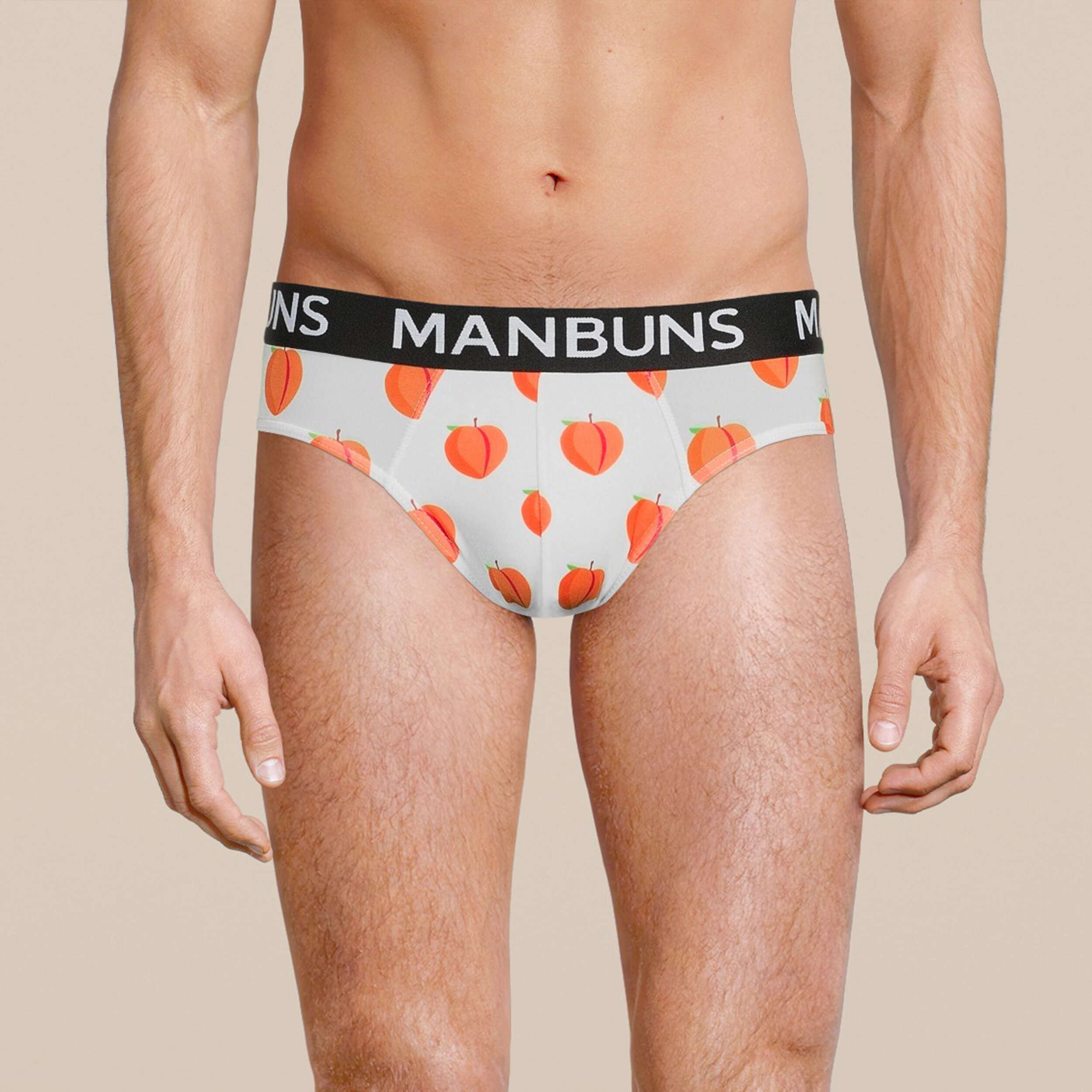 Men's Peach Brief Underwear made from breathable mesh fabric, featuring a slim fit design and vibrant peach color, perfect for workouts and casual wear.