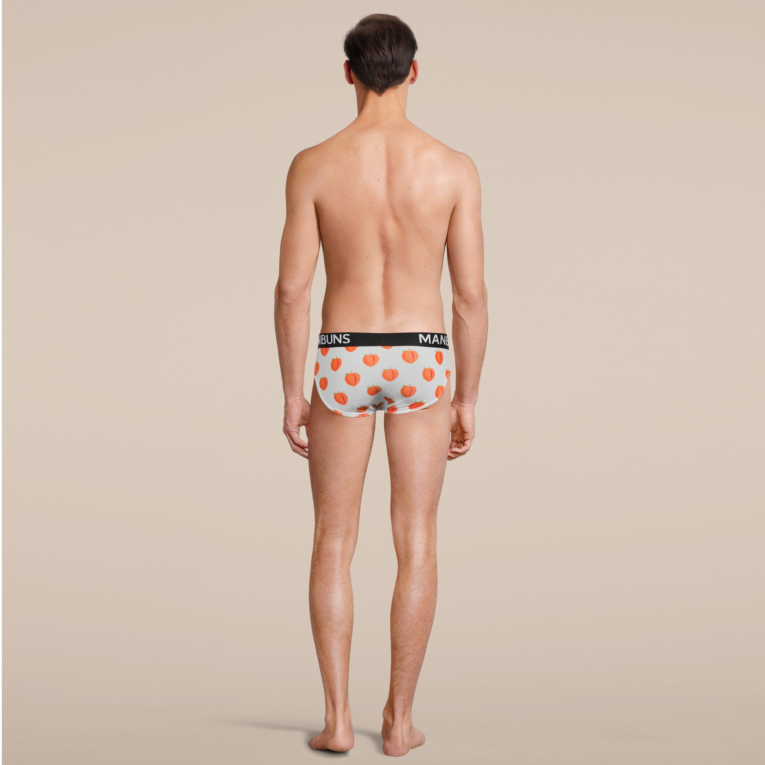 Men's Peach Brief Underwear made from breathable mesh fabric, featuring a slim fit design and vibrant peach color, perfect for workouts and casual wear.