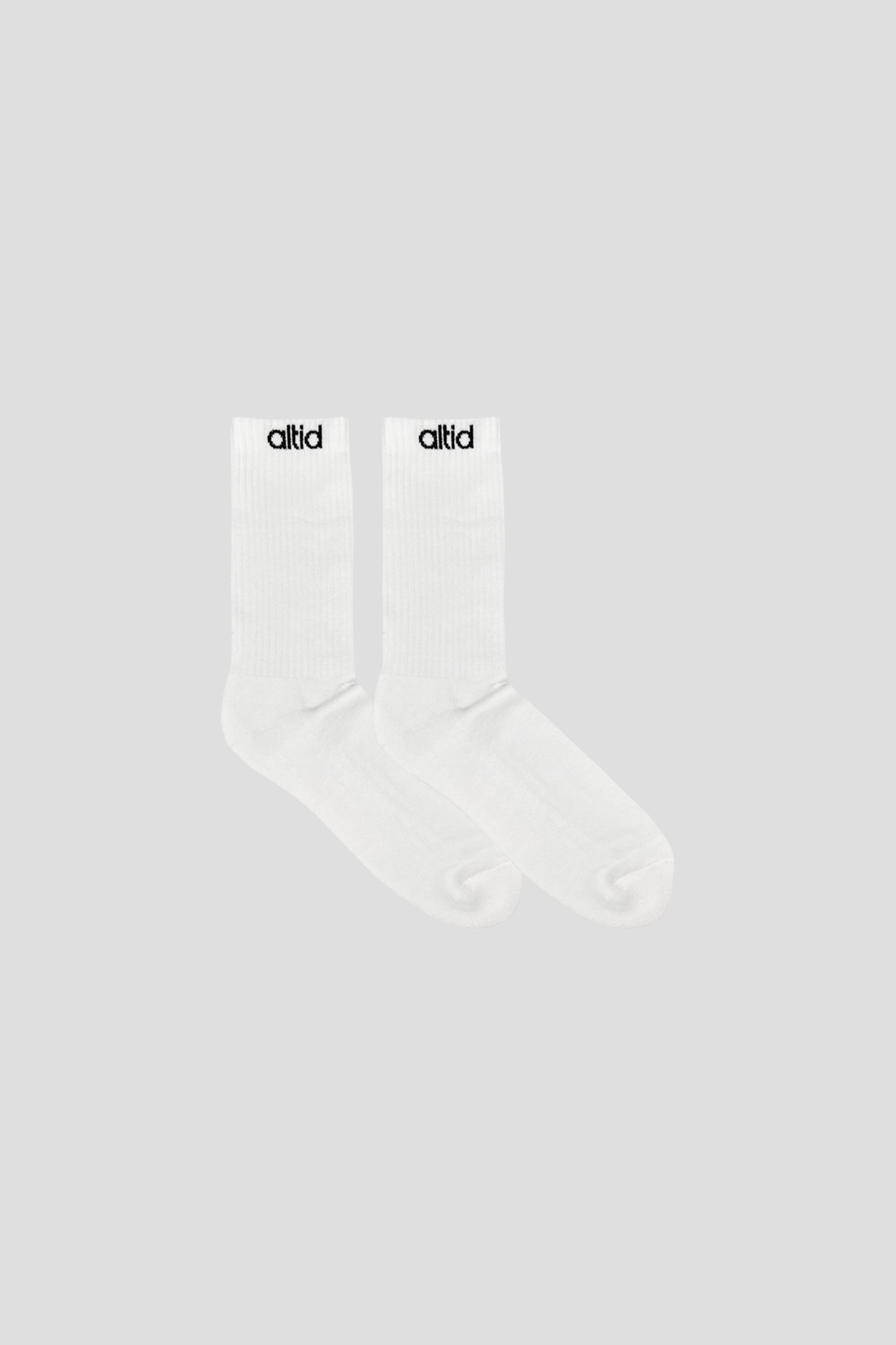 Two pairs of black altid logo socks made from organic cotton blend, showcasing soft texture and stylish branding.