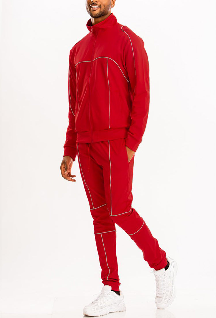 3M Reflective Pipe Track Set featuring reflective details, elastic waist, and standard pockets, displayed on a model.