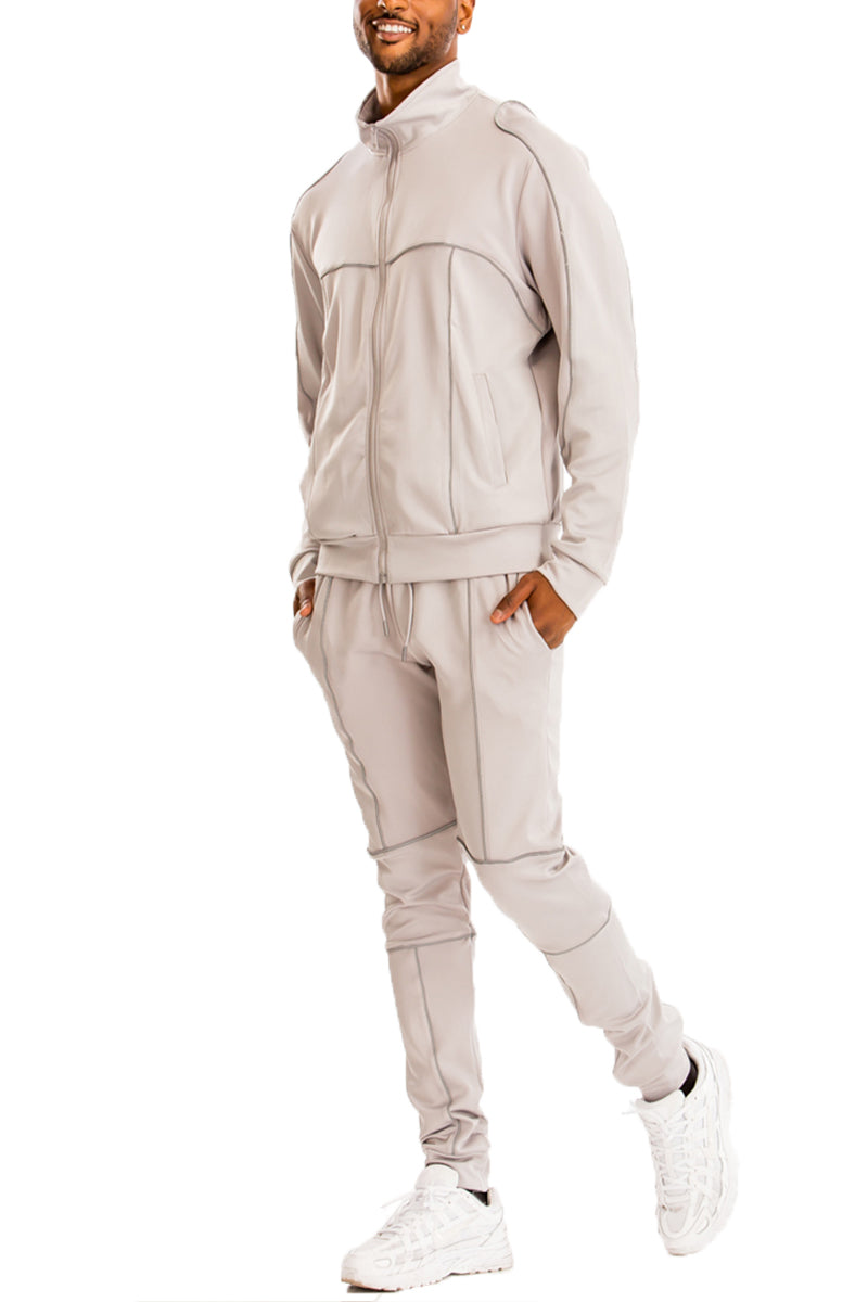 3M Reflective Pipe Track Set featuring reflective details, elastic waist, and standard pockets, displayed on a model.