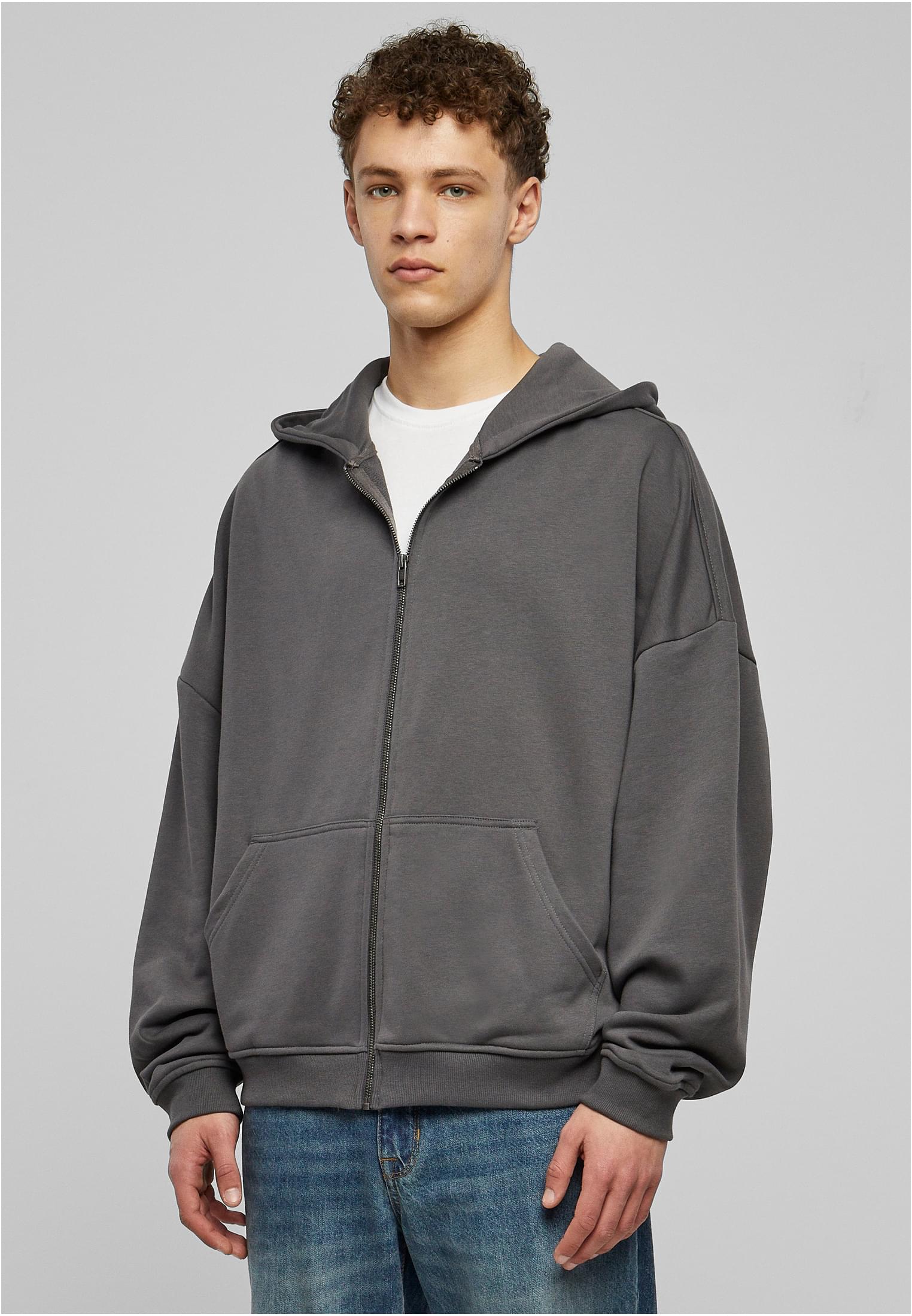 Men's 90s Zip Hoodie in soft terry fabric, featuring a large hood, split kangaroo pocket, and metal zipper for a stylish urban look.