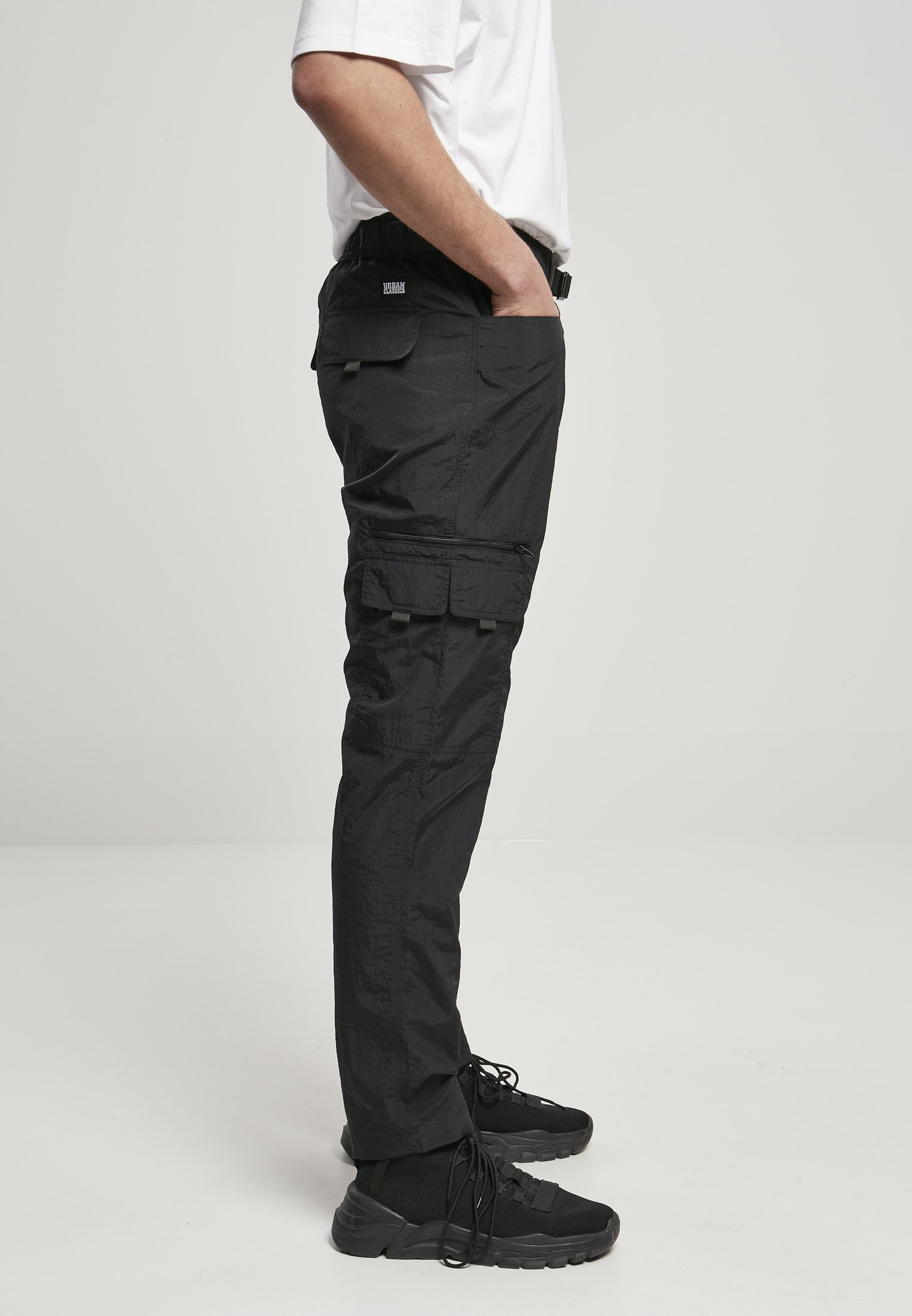 Men's adjustable nylon cargo pants featuring multiple pockets and a matching belt, perfect for summer wear.