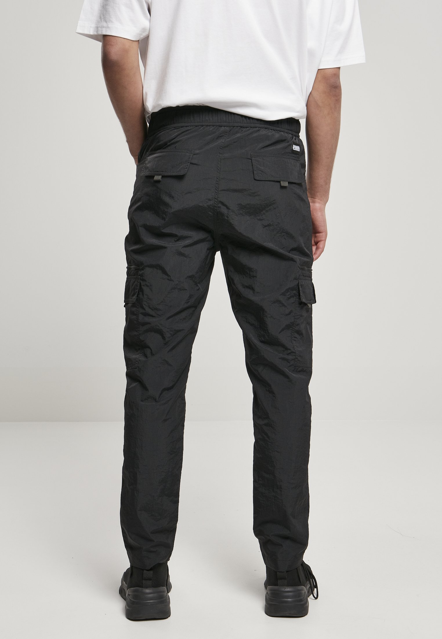 Men's adjustable nylon cargo pants featuring multiple pockets and a matching belt, perfect for summer wear.