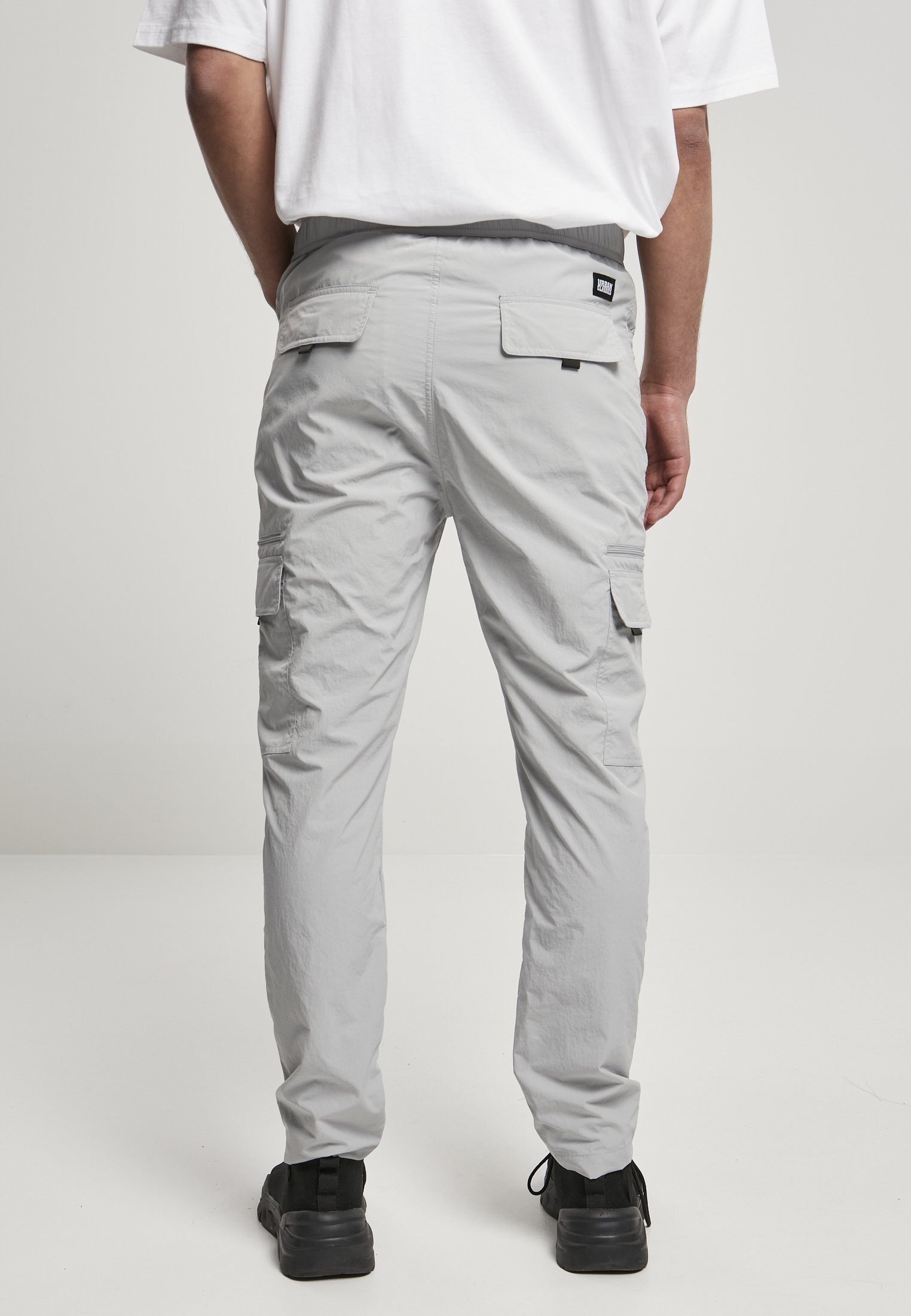 Men's adjustable nylon cargo pants featuring multiple pockets and a matching belt, perfect for summer wear.