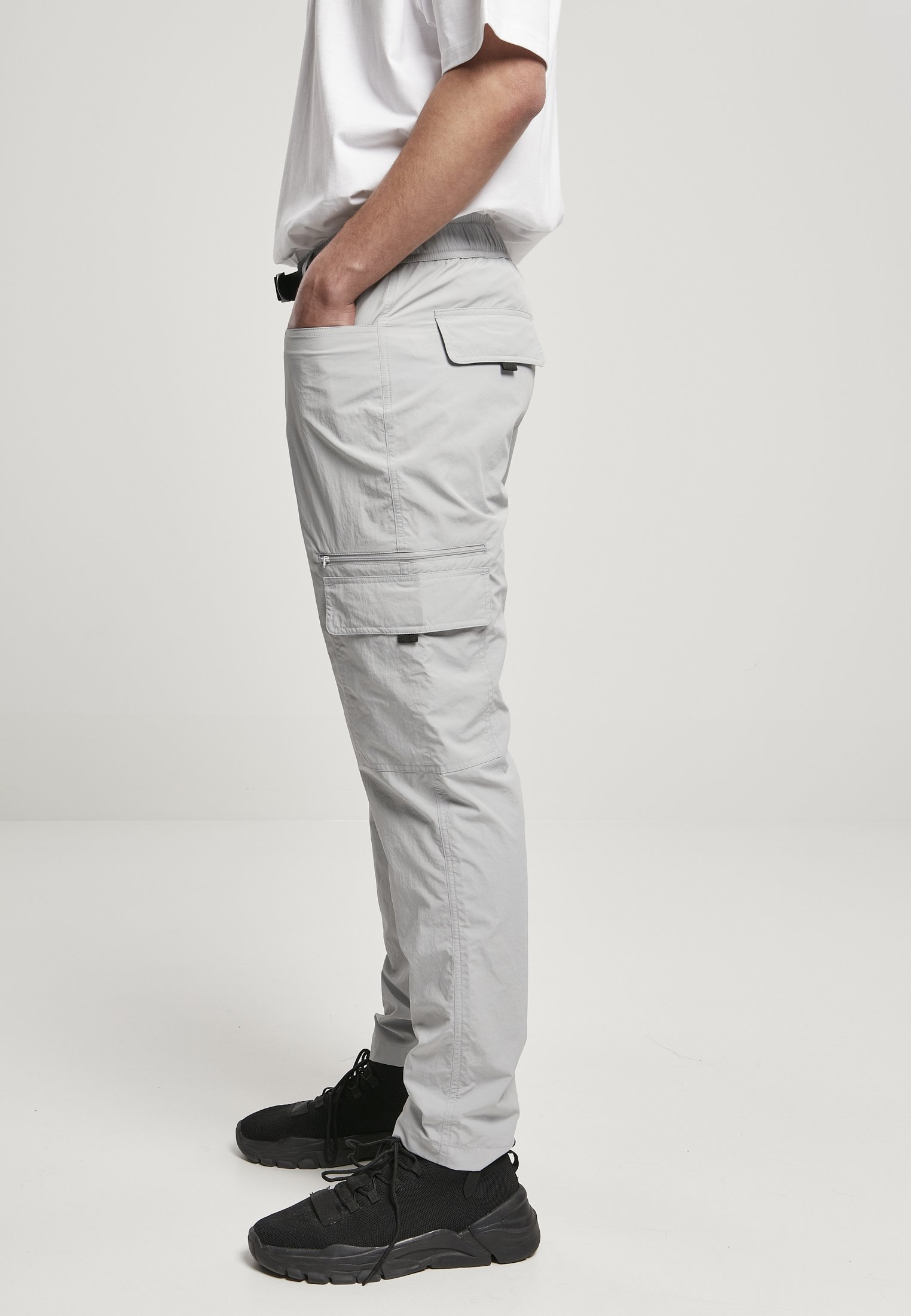 Men's adjustable nylon cargo pants featuring multiple pockets and a matching belt, perfect for summer wear.