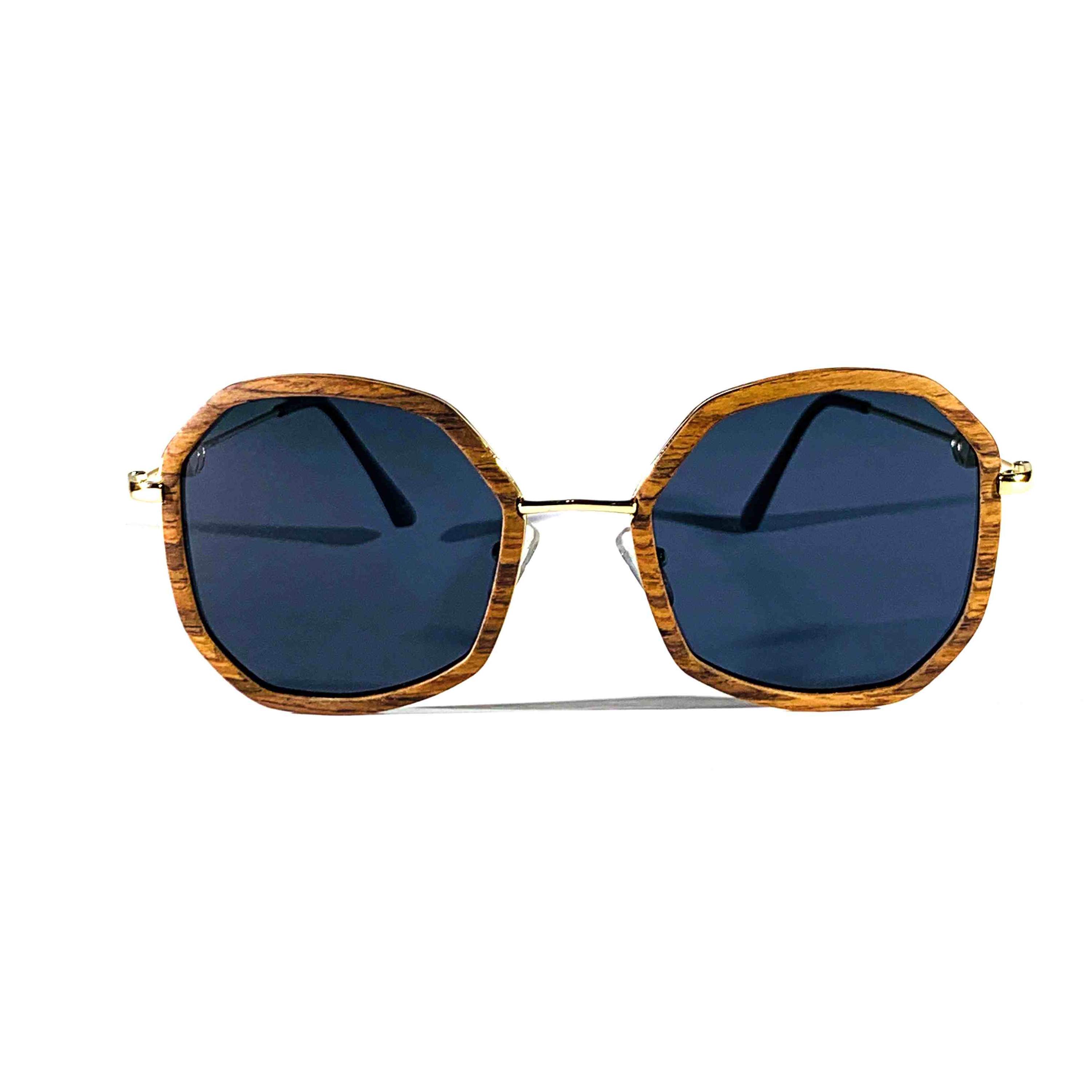 Ansley sunglasses featuring a rosewood frame and gray polarized lenses, showcasing a stylish and unique design.