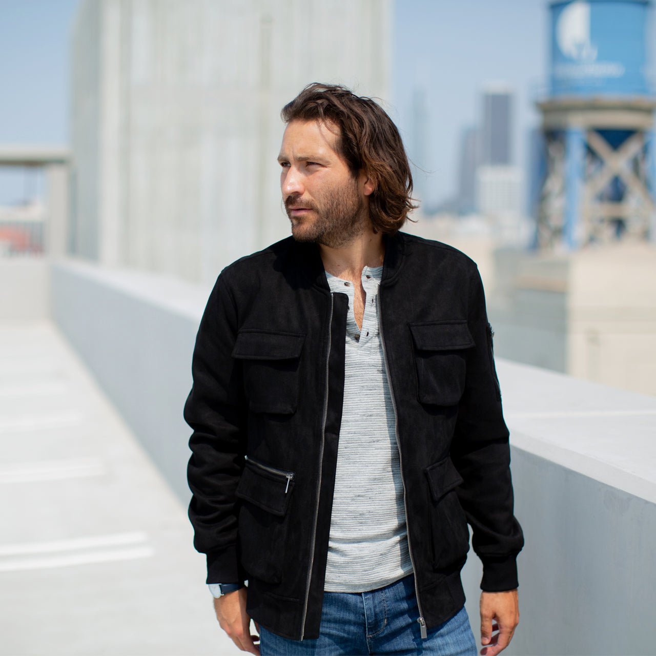 Austin Suede Cargo Bomber Jacket in black with multiple cargo pockets, showcasing its stylish and cozy design.