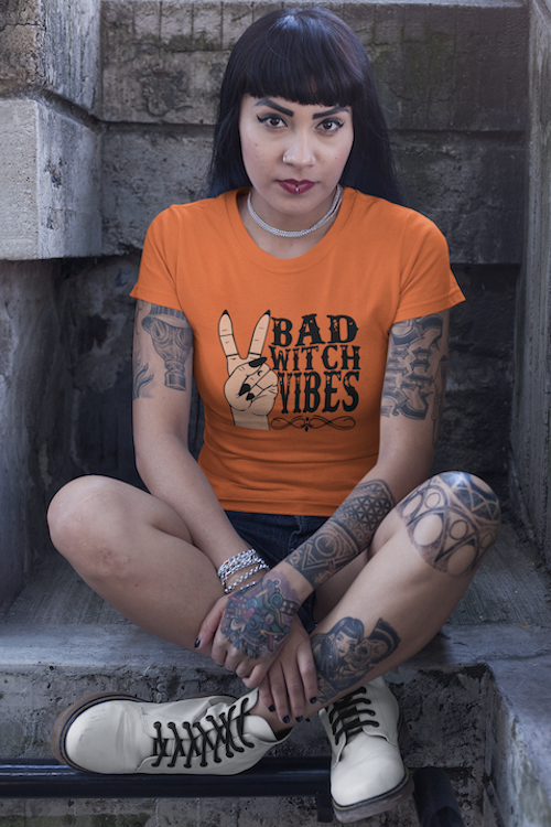 A stylish Bad Witch Vibes T-Shirt made from soft ring-spun cotton, featuring a bold design perfect for casual wear.