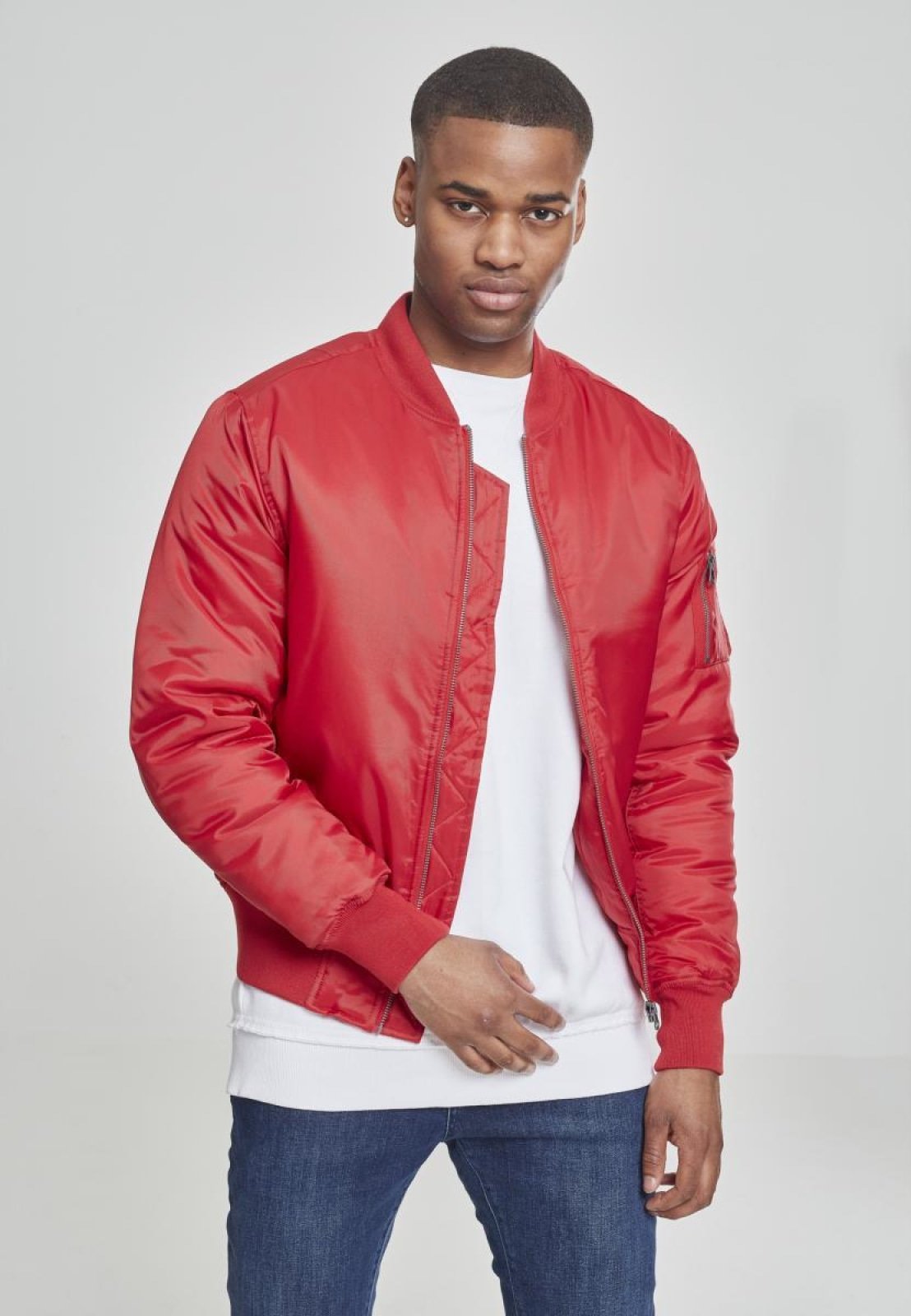 Basic Bomber Jacket featuring orange lining and zippered arm pocket, available in various colors.