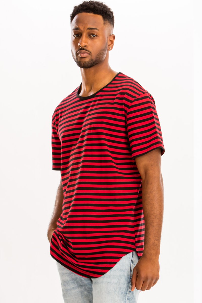 A model wearing a BASIC STRIPED TEE in an oversized fit, showcasing its stylish striped design and comfortable fabric.