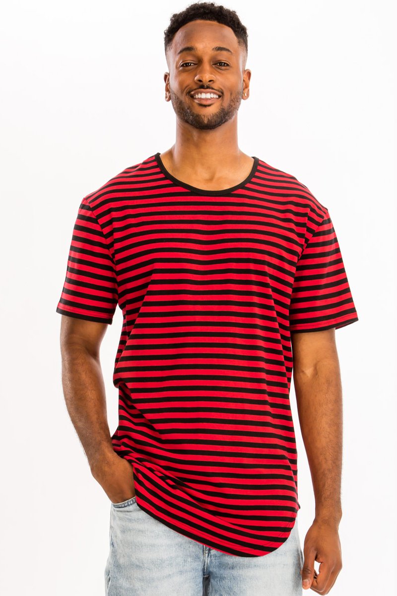 A model wearing a BASIC STRIPED TEE in an oversized fit, showcasing its stylish striped design and comfortable fabric.