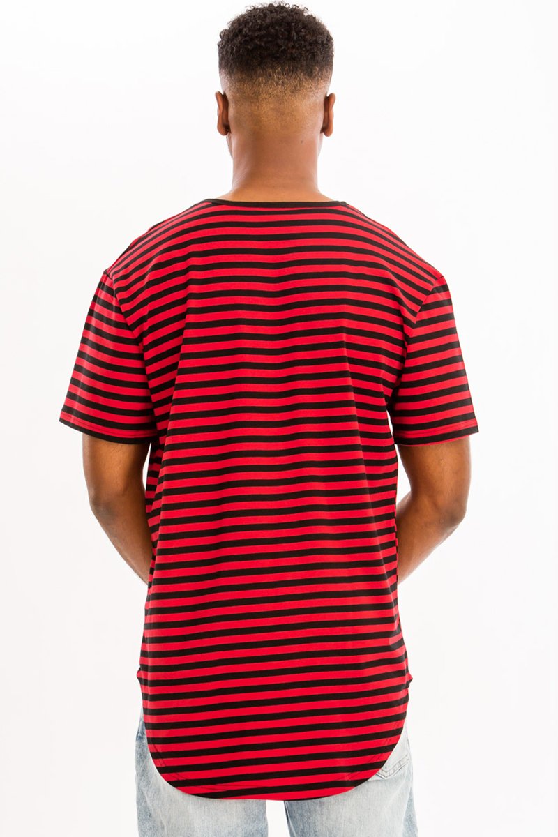 A model wearing a BASIC STRIPED TEE in an oversized fit, showcasing its stylish striped design and comfortable fabric.