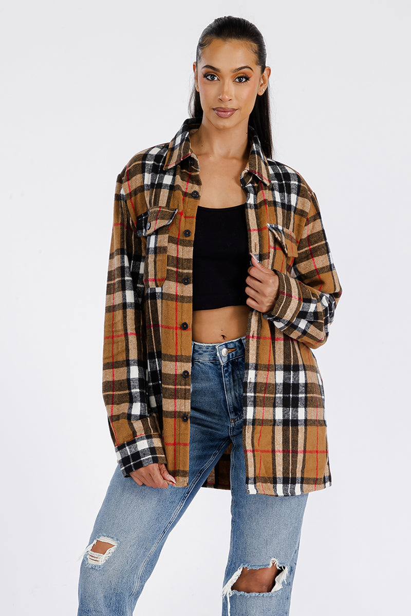 A stylish oversized flannel shacket for women, featuring button closure and chest pockets, made from soft brushed fabric.