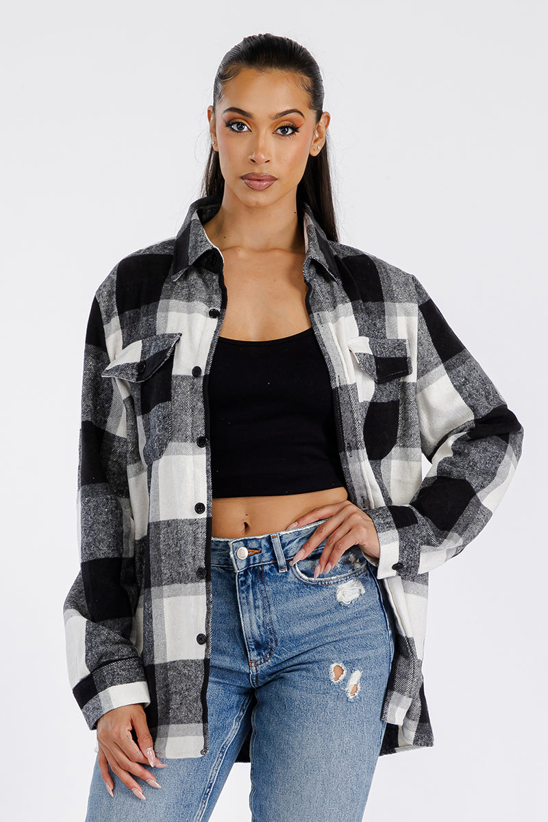 A stylish oversized soft flannel shacket for women, featuring button closure and chest pockets, perfect for layering.